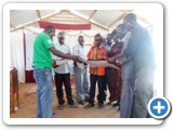 Patrick Donald Oucha, Rev. Philip Lokwaar Lokaalei and church Elders during brief review of approved building plan. Sunday Jan 19/2014