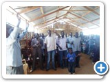 Patrick Donald Oucha joins Church members in zinging praise songs. This was at Kenya Assemblies of God (K.A.G) Church kanamkemer-Lodwar